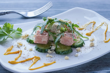 Salad with canned tuna, boiled egg and fresh cucumber.