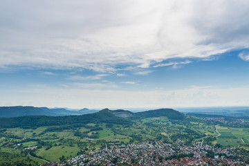 Fototapeta premium Germany, Endless landscape view over village Neuffen and green mountains