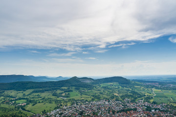 Fototapeta na wymiar Germany, Endless landscape view over village Neuffen and green mountains