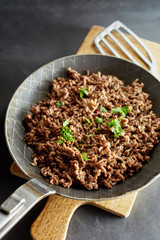 Pan with fried minced meat and chives