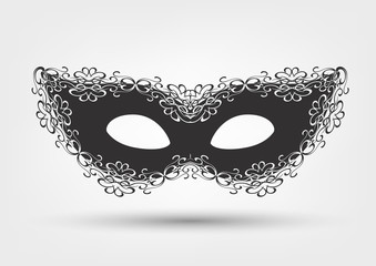 Black masquerade mask with lace on white background, carnival
