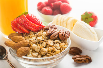 Closeup view of granola bowl with nuts and fruits