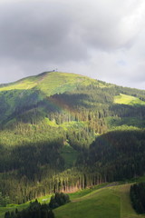 Rainbow over valley with Schattberg Mountain in background, Saalbach-Hinterglemm, Alps, Zell am See district, Salzburg federal state, Austria 