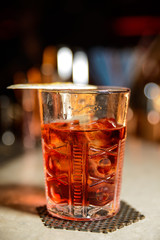 Alcoholic cocktail row on bar table