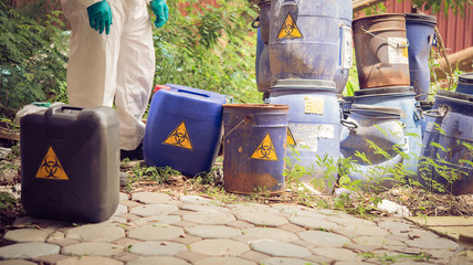 Asian scientist wear Chemical protection suit check danger chemical,working at dangerous...
