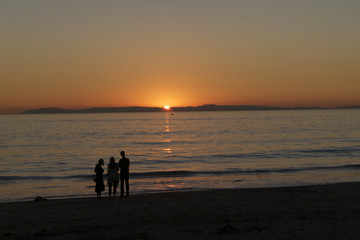 sunset people silhouette beach