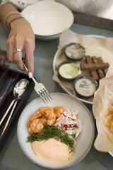 Snacks for beer: shrimp, sauce, chips, toast. 