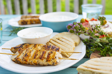 Delicious grilled chicken souvlaki, traditional Greek dish. © iMarzi