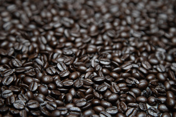 photo macro close up texture of roasted coffee beans dark, can be used as a background.