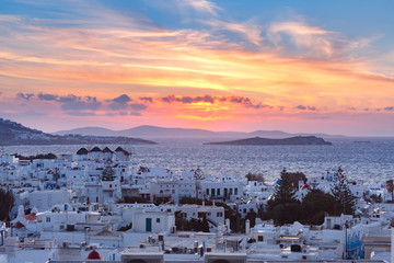 Famous view, Traditional windmills at sunset in Mykonos City, Chora, on the island Mykonos, The island of the winds, Greece