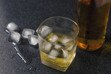 Whisky and glass drop ice cubes, alcohol wallpaper.