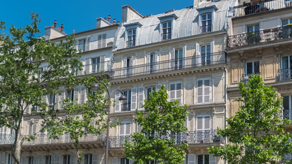 Paris, beautiful building, typical parisian facade in the Marais 
