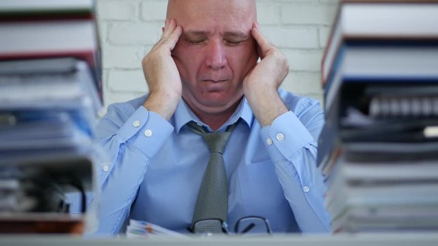 Businessman Image in Archive Accounting Room Suffering a Big Headache