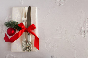 Christmas table setting on the white tablecloth.Top view.Copy space.