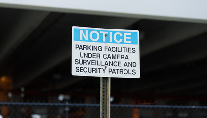 Notice Parking Facilities Under Camera Surveillance Sign