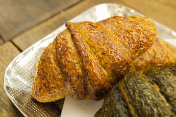 Delicious and buttery Truffle Croissants made by pastry chef. All look very tasty and delightful. Natural light. Close up.