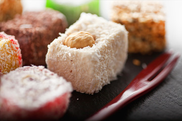 Oriental dessert-Turkish delight next to the dessert fork.