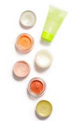 Creamy make up products - top view of decorative cosmetic containers isolated on white backgroiunds