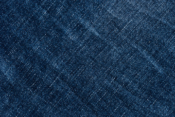 Denim jeans texture or denim jeans background. Old grunge vintage denim jeans.