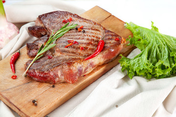 Pork with pepper, hot chili, garlic and rosemary. Isolated on white background. Place for text. Closeup view. Top view.