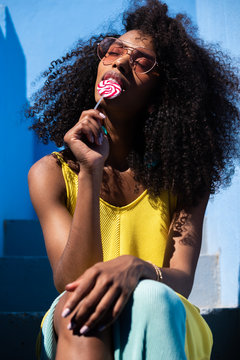 Beautiful black woman with a lollipop