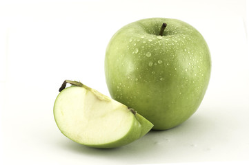 Green apple and a slice of green apple isolated on white