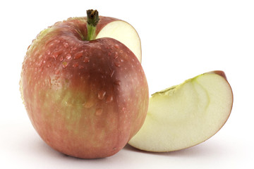 Red apple with a slice isolated on white