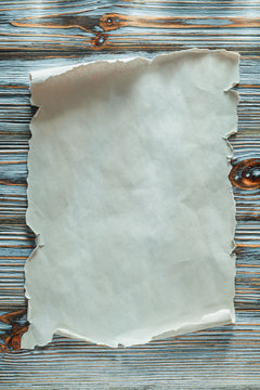 Vintage blank paper roll on blue wooden background