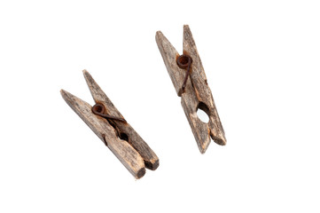 Two old wooden clothespins isolated on white background