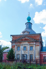 Fototapeta na wymiar The building of the Orthodox Church of the 19th century in the style of classicism in a regional city, Venev, Tula region, Russia