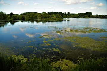 Lake view with clouds reflections in a sunny day