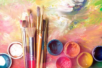 Artist paint brushes and paint cans