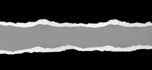Ripped black paper on gray background banner