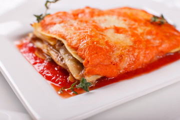 Italian Food. Hot tasty Classic Lasagna with bolognese sauce on white plate.