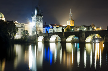Fototapeta na wymiar Old town with Charles Bridge from the Vltava River at night