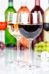 Red wine in a glass portrait format grapes