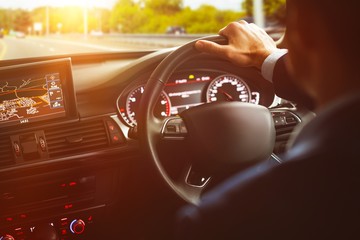 Close-up of steering wheel and navigation system