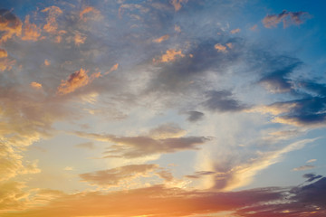 Beautiful sunset with the sun of orange tones behind the mountains and deep blue sky