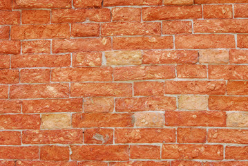 Fototapeta premium Damaged red brick wall as background