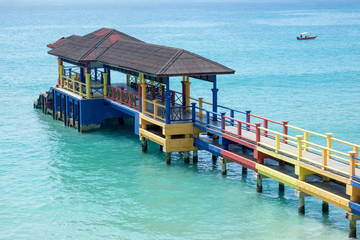 colorful boat jetty on a  blue sea.
