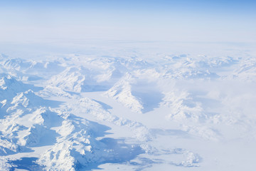 Fototapeta na wymiar Winter snow landscape from plane above over iceland traveling from Keflavik to canada