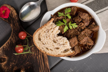 Beef meat stew in ceramic pot.