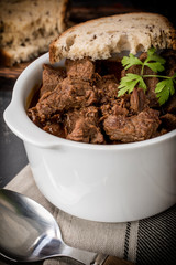 Beef meat stew in ceramic pot.
