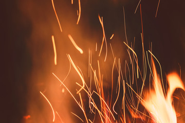 Night bonfire background with smoke and sparks in motion blur