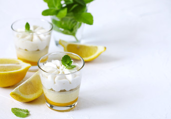 Limoncello - italian Dessert.  Lemon Cheesecake Mousse with Whipped Cream in cups. Summer dessert.