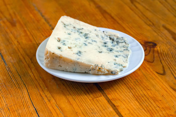 Piece of cheese in a plate
