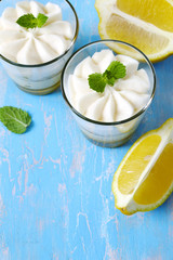 Limoncello - italian Dessert.  Lemon Cheesecake Mousse with Whipped Cream in cups. Summer dessert.
