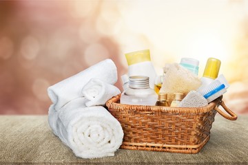 Fototapeta na wymiar Bath towel and basket with accessories