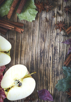 Autumn frame wth apple, cinnamon stick, star anise and clove