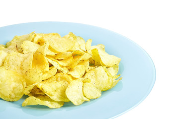 Potato chips on blue plate. Isolated  on white background